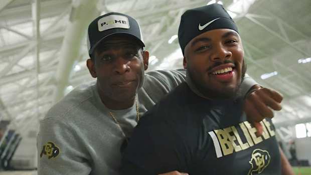 Deion Sanders with Chidozie Nwankwo at CU's practice field
